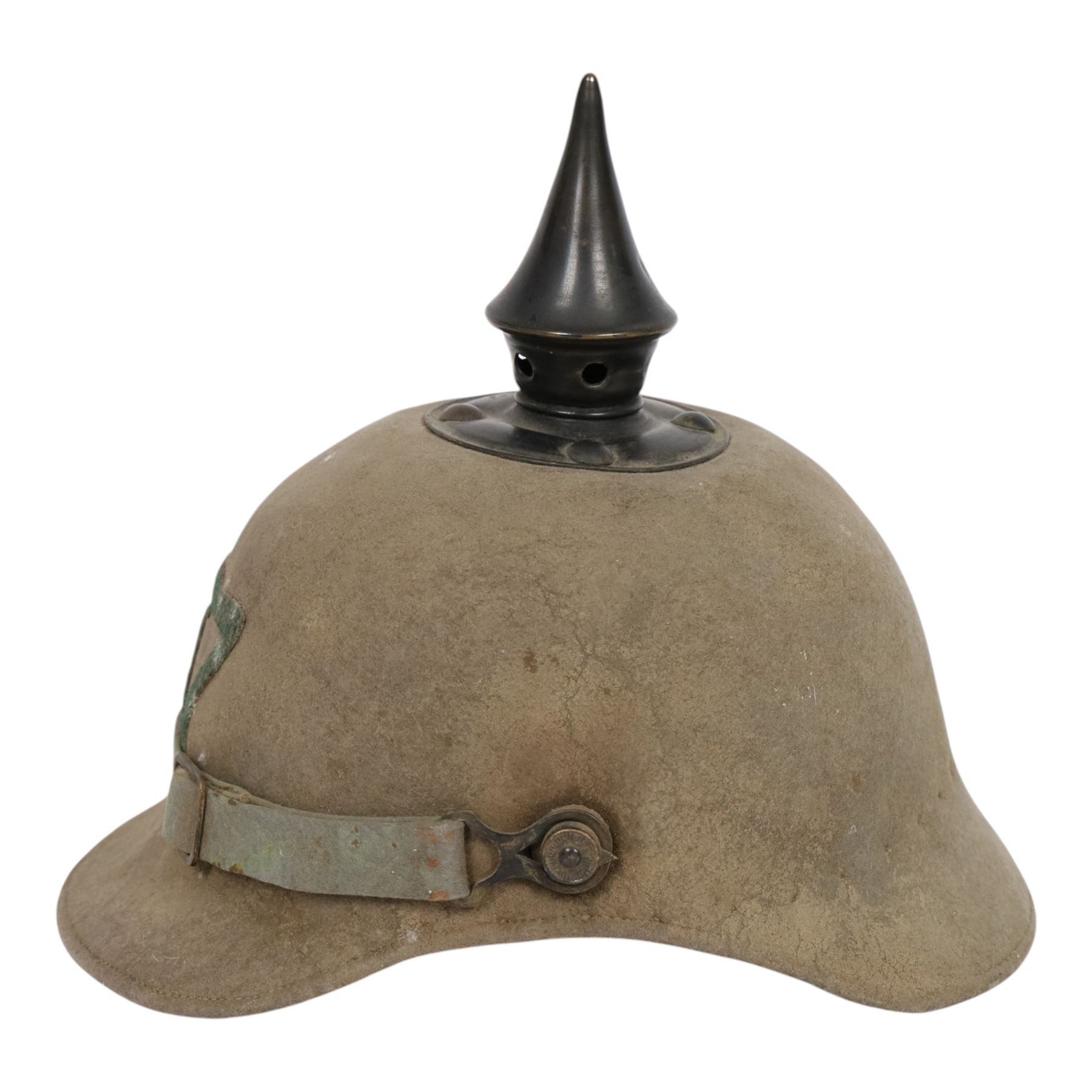 WWI Prussian 57th regiment Ersatz felt Pickelhaube, the grey felt skull with steel spike finial, stitched with green felt 57, chin strap, one side with a black cockade, the other black and red