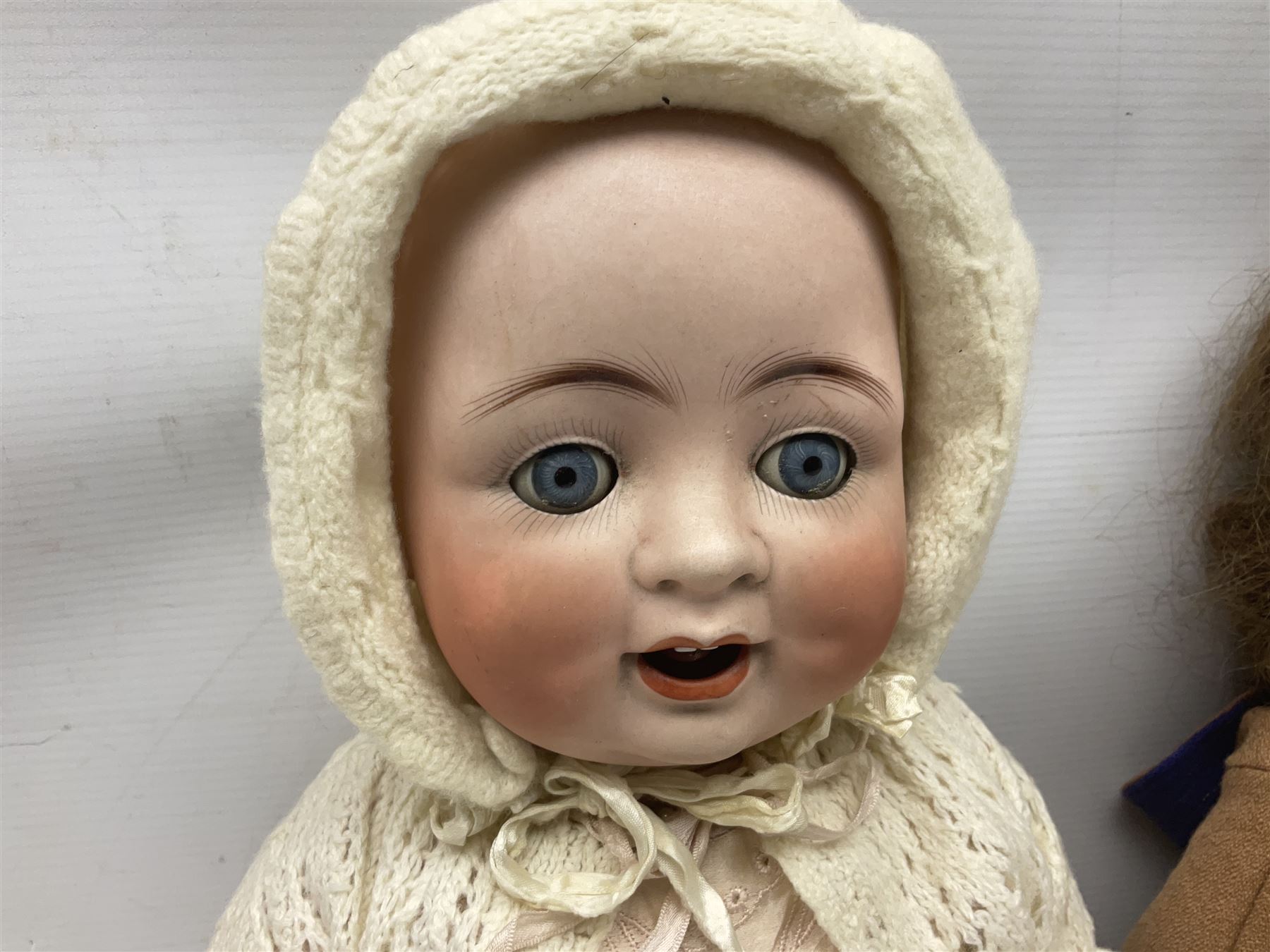 Catterfelder Puppenfabrik Germany bisque head baby doll with moulded hair, sleeping eyes, open mouth with teeth and trembly tongue, and composition body with jointed limbs; marked 'C.P. 208/50 V S' H50cm; together with an Armand Marseille bisque head doll with applied hair, sleeping eyes, open mouth with teeth and composition body with jointed limbs; marked 'Made in Germany Armand Marseille 390n D.R.G.M. 246/1 A. 6 M.' H56cm (2)