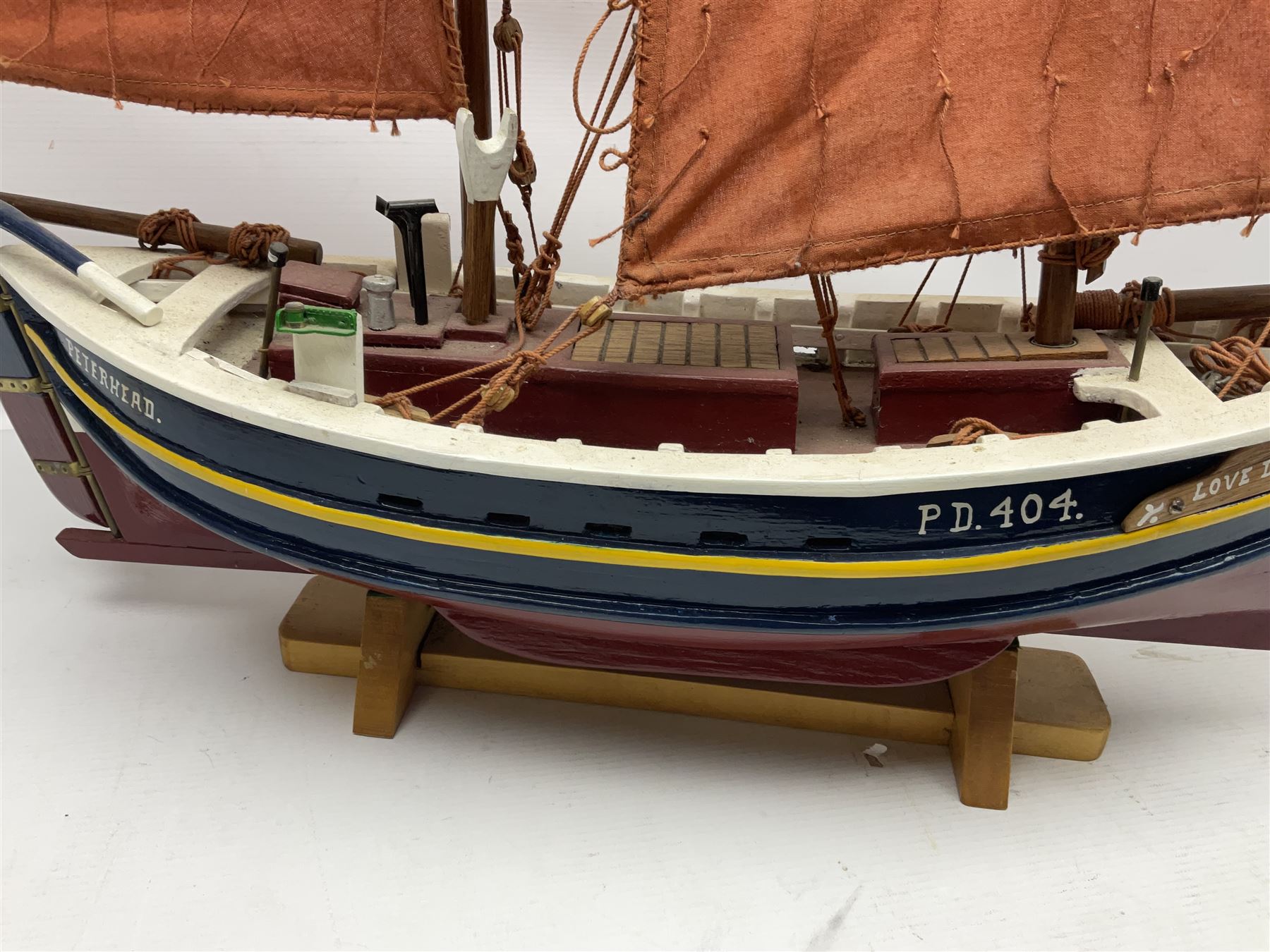 Wooden model of the Peterhead Herring Fishing Boat, Love Divine, PD404. on stand together with Wick Herring Fishing Boat, Galilee WK.1. on stand, L105cm, H64cm