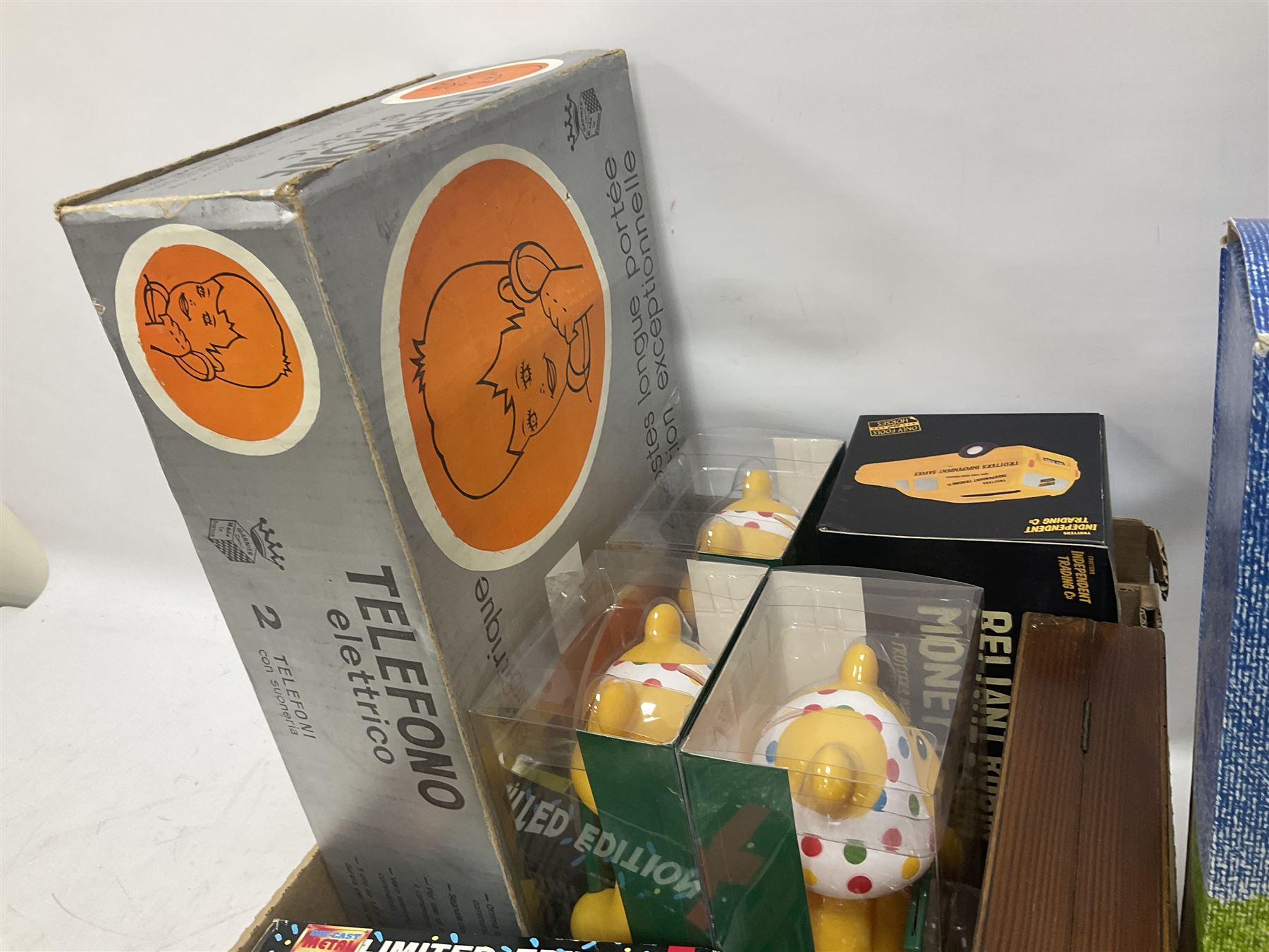 Collection of vintage and later toys and memorabilia to include Merlin’s Football sticker book, boxed child’s electric telephones, Only Fools and Horses money box, four boxed The Promenade Collection dolls etc in two boxes