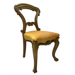 Pair of Victorian walnut side chairs, shaped cresting rail carved with acanthus leaves, overstuffed upholstered seats with stud band, on cabriole supports with scroll carved terminals