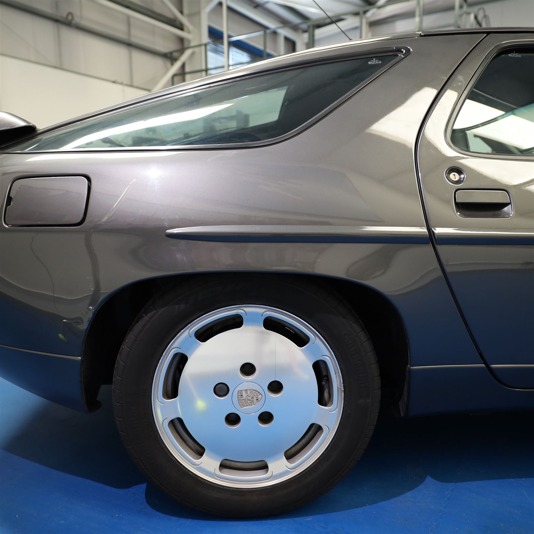 1991 Porsche 928 S4 Automatic Coupé

Registration: L644 LBE
Date of first registration as shown on V5: 1 July 1994
Porsche year of manufacture: 1991
Engine: 5.0-litre V8 petrol
Transmission: Automatic
Odometer reading: 37,886 kilometres (approximately 23,541 miles)
Colour: Slate Grey metallic
Interior: Black leather
V5C: Present
Keys: One
Chassis number: WP0ZZZ92ZMS800460

An exceptional Porsche 928 S4 Automatic Coupé finished in Slate Grey metallic with a black leather interior. The car displays a notably low odometer reading of just 37,886 kilometres, equivalent to approximately 23,541 miles.

The 928 S4 combined Porsche’s powerful 5.0-litre V8 engine with a sophisticated rear-mounted transaxle, creating a refined and accomplished grand tourer. This example is equipped with automatic transmission, electrically adjustable front seats, air conditioning, alloy wheels and the characteristic rear spoiler.

The car was purchased from Specialist Cars of Malton in June 2019, at which time the recorded mileage was 36,650 kilometres. The accompanying service record includes evidence of a cam belt replacement.

Presented in excellent condition throughout, the bodywork and metallic paint finish appear particularly well preserved, while the cabin retains its original character with black leather upholstery and 928-branded sill trims. A Japanese Porsche service label records maintenance entries at 31,902, 33,397 and 34,134 kilometres.

The car also features a Porsche Classic Communications Management (PCCM) upgrade system.

Features

• 5.0-litre V8 petrol engine
• Automatic transmission
• Slate Grey metallic paintwork
• Black leather interior
• Electrically adjustable front seats
• Air conditioning
• Porsche alloy wheels
• Rear spoiler
• Right-hand drive
• Odometer reading of 37,886 kilometres, approximately 23,541 miles
• Purchased from Specialist Cars of Malton in June 2019
• Recorded at 36,650 kilometres when purchased
• Service record showing cam belt replacement
• Japanese Porsche service label
• V5C present
• One key

This vehicle forms part of the Estate of the Late John Sils and is offered for sale by the Executors, confirming a genuine reason for sale.