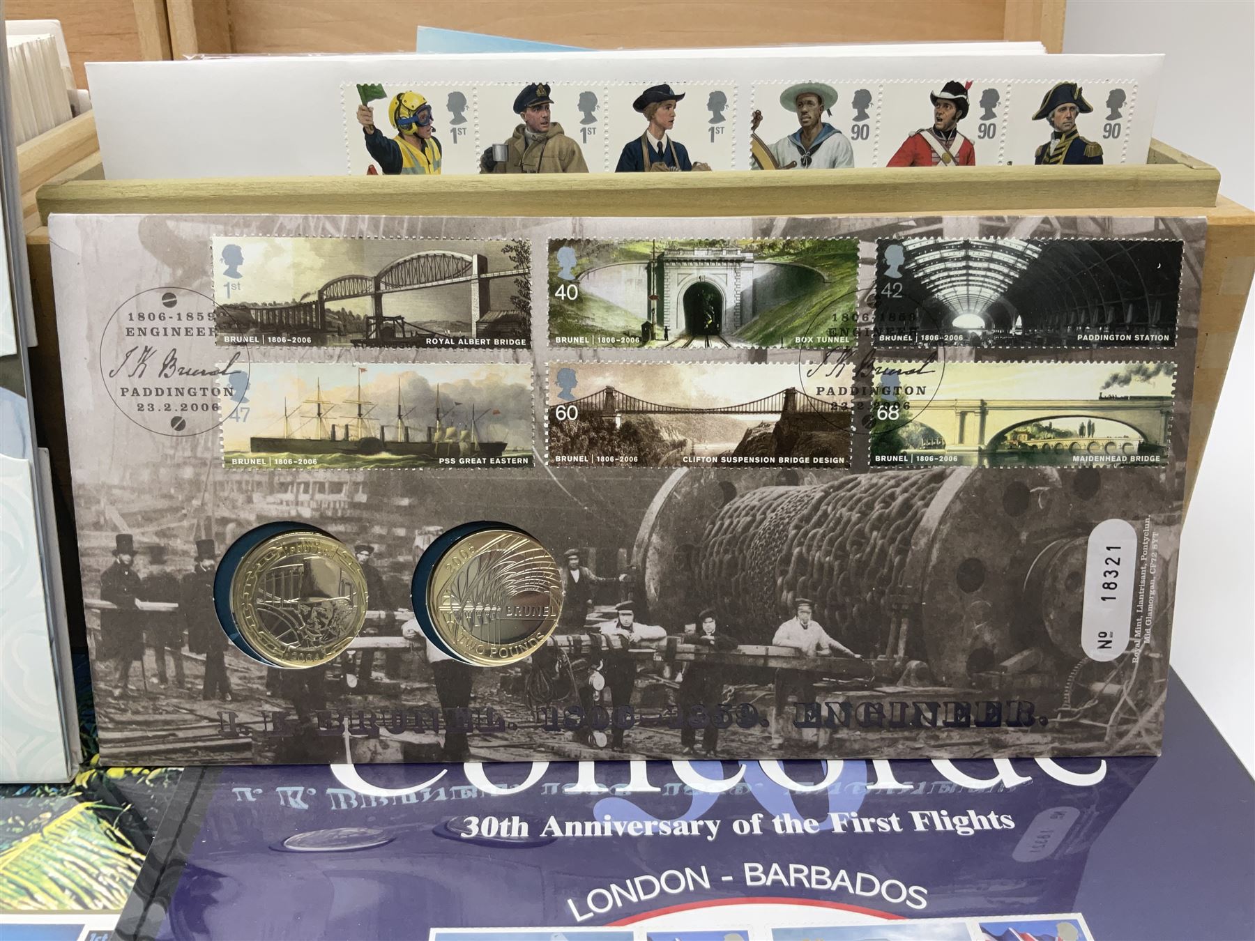 Coins and stamps, including The Royal Mint Great Britain 1970 coin set in plastic holder, 2006 'Brunel' coin cover containing two commemorative two pound coins, Alderney 2006 sterling silver proof five pounds, two 2007 five pound coins in card folders, two limited edition mint first class stamp sheets each comprised of ten first class stamps, various first day covers many with special postmarks housed in 'Royal Mail' boxes etc