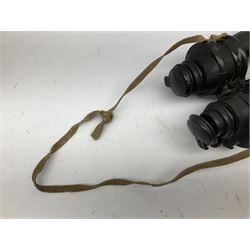 Pair of WWII German U-boat binoculars probably 7 x 50 by Leitz, with rubber eye piece protector covers and leather case stamped with Kriegsmarine mark to the lid and dated 1944, with leather strap.