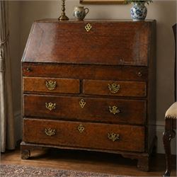 Georgian oak bureau, fall front with pierced brass escutcheon and handles, revealing a fit...