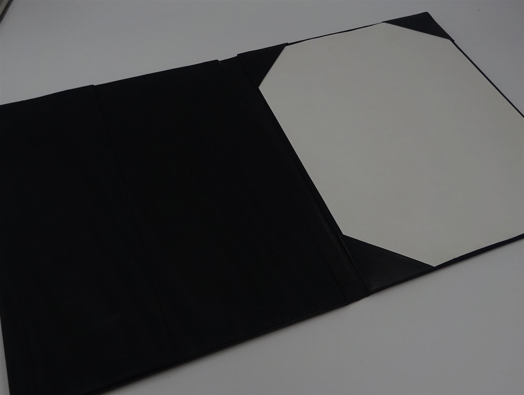 Modern silver mounted leather writing case, with repousse floral and foliate decoration to the silver cover, hallmarked Laurence R Watson & Co, Sheffield 1991, H29.5cm, boxed