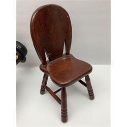 Large painted composite figure of Charlie Chaplin, seated upon wooden chair, H54cm