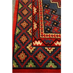  Tunisian rug, blue ground field with stylised decoration, 235cm x 166cm  