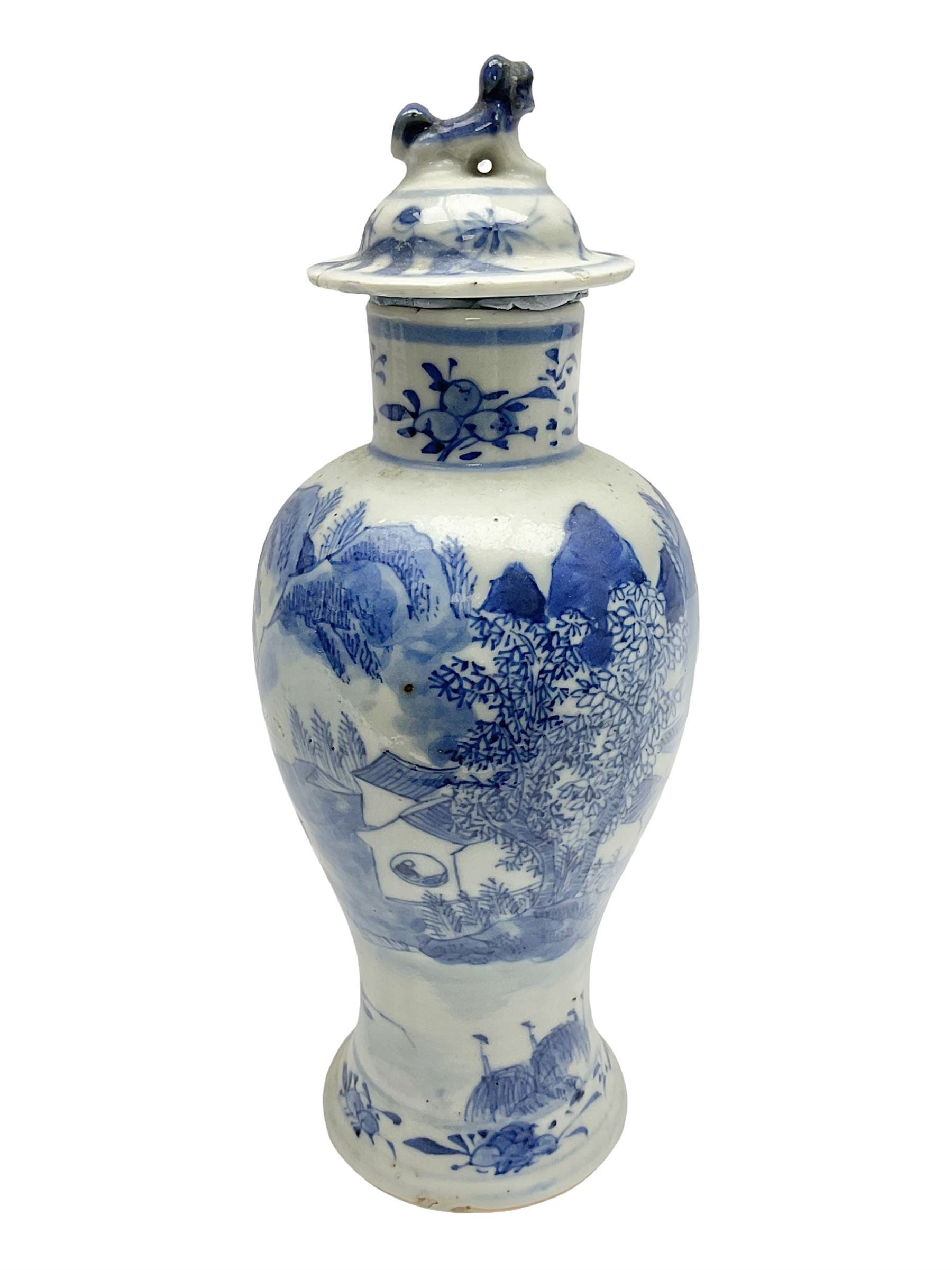 19th century Chinese Kangxi style blue and white jar and cover, decorated with figural and landscape scenes, the domed cover with foo dog finial, with four character marks beneath, H22cm