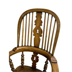 Early 19th century elm and ash Yorkshire Windsor armchair, high stick back with pierced and fretwork splat, turned supports joined by double H-stretcher