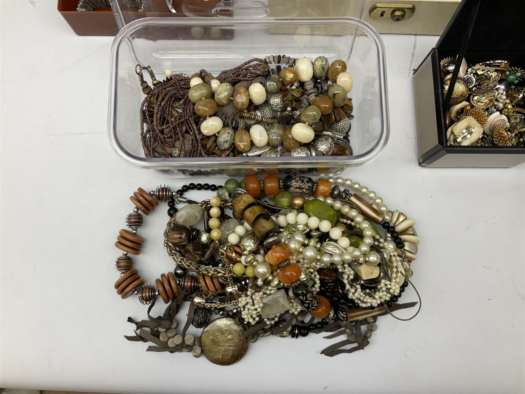 Collection of costume jewellery including enamel and marcasite flower brooch, two V Villani Italy bangles, clip on earrings, brooches, bangles, beaded necklaces and a Skagen wristwatch