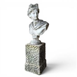 Roman Neoclassical style cast stone bust, weathered finish, raised on textured stone plinth of tapering form