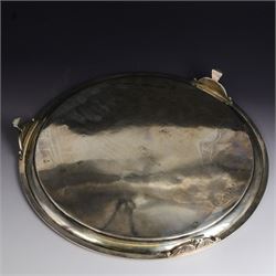 Victorian silver tray, of circular form with beaded rim, engraved to the centre with floral decoration, upon three scroll mounted paw feet, hallmarked Walter & John Barnard, London 1877, D30.5cm