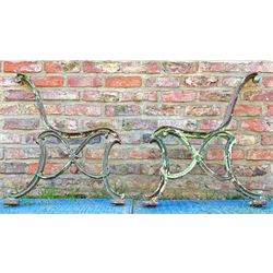 Pair of Victorian cast iron park bench ends. H76cm, D66cm. 