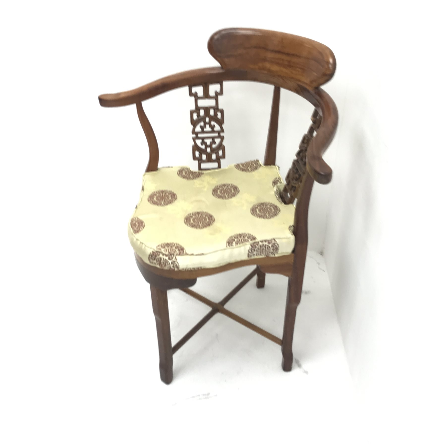 Chinese rosewood corner chair, carved and pierced splats, shaped seat, square supports joined by stretchers, W70cm