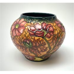 A Moorcroft vase, of squat baluster form, circa 2000, decorated in the Cosmos pattern, with impressed and painted marks beneath, H10.5cm. 