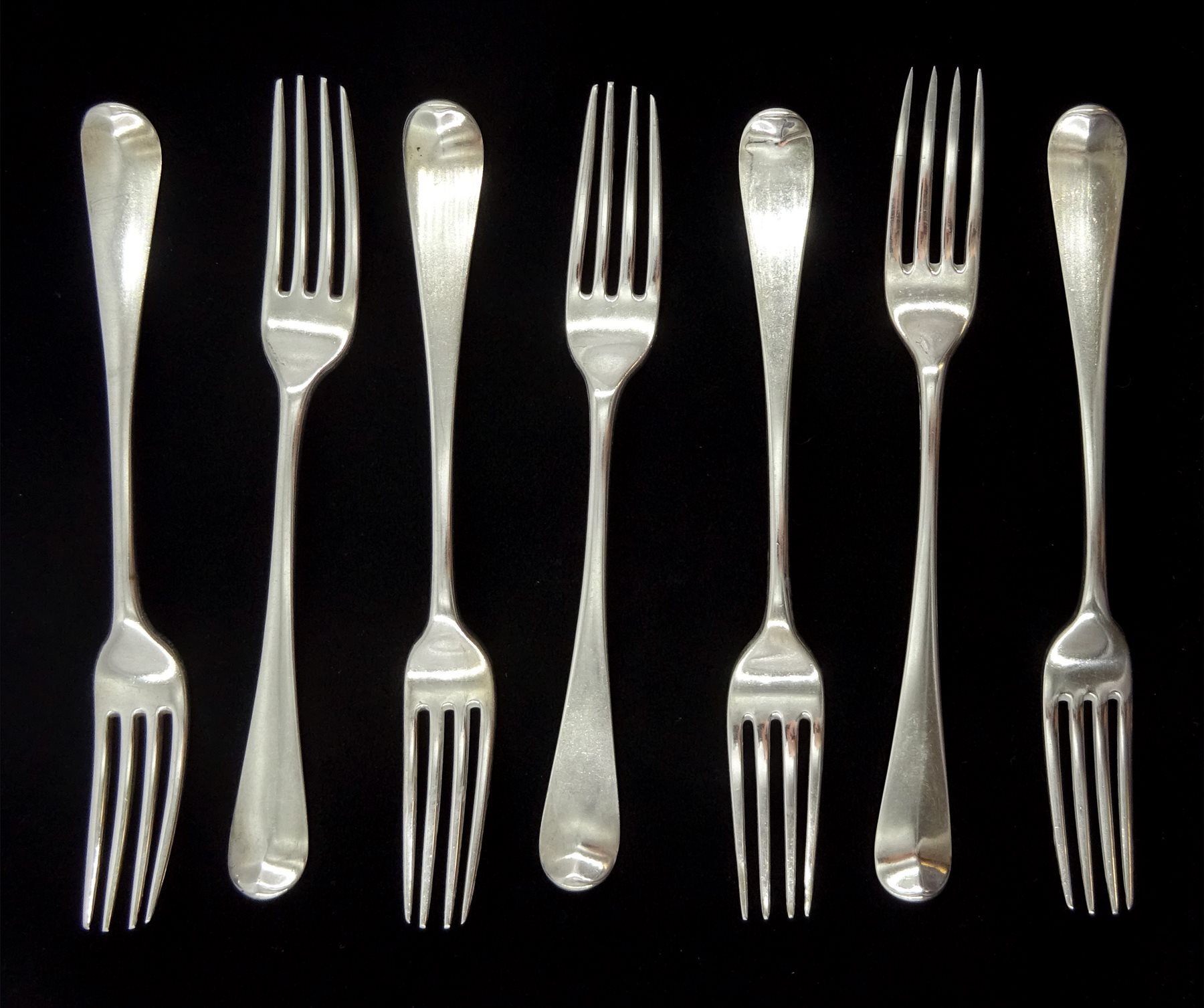 Five George III silver dinner forks, Old English pattern by Richard Crossley, London 1800 and two other similar forks London 1792 and 1817, approx 15.2oz (7)