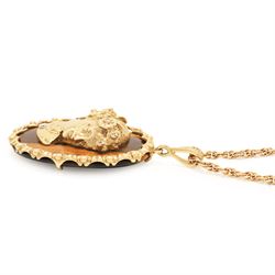 9ct gold tiger's eye diamond and sapphire portrait pendant necklace, oval cut tiger's eye, with applied bust of a lady in profile, her hair set with diamonds and necklace set with a sapphire, within a scalloped design frame, on a fancy twist chain necklace, both hallmarked
