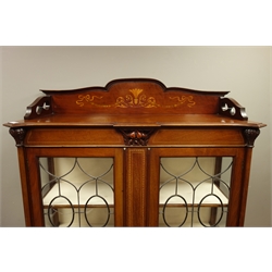  Edwardian inlaid mahogany display cabinet, raised shaped back inlaid with scrolls, ribbons and trailing husks, enclosed by two lead glazed doors, shaped apron, cabriole supports, W108cm, H165cm, D43cm  