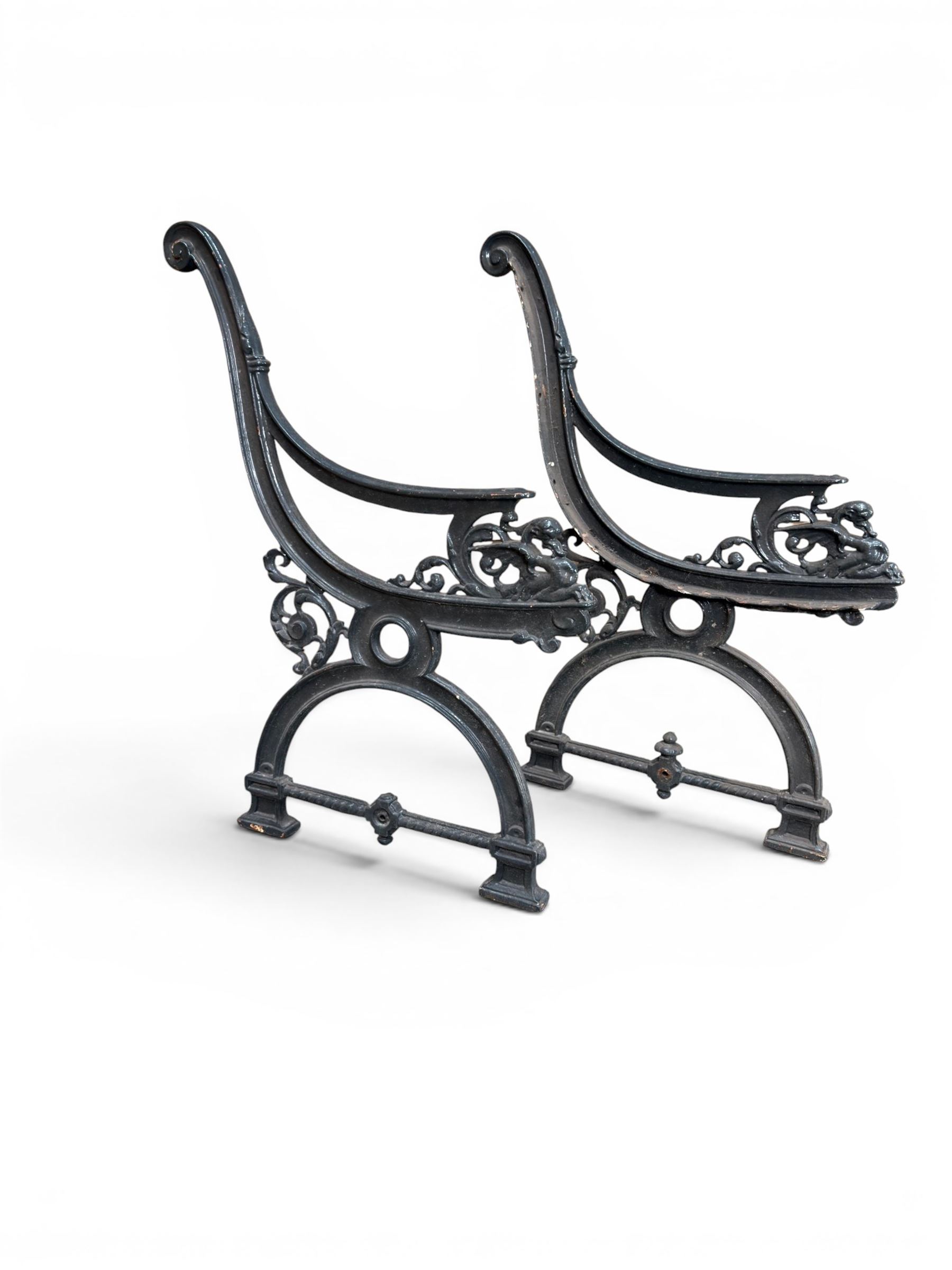 Yates Haywood - pair of 19th century cast iron bench ends, winged griffin detail, arched legs with rope turned decoration, finish in green paint, registration number 206550, first registered 8 March 1867 (see illustration), length as required