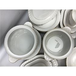 Chodziez Polish dinner wares decorated in white and gilt to include lidded twin handled tureens, bowls, plates etc