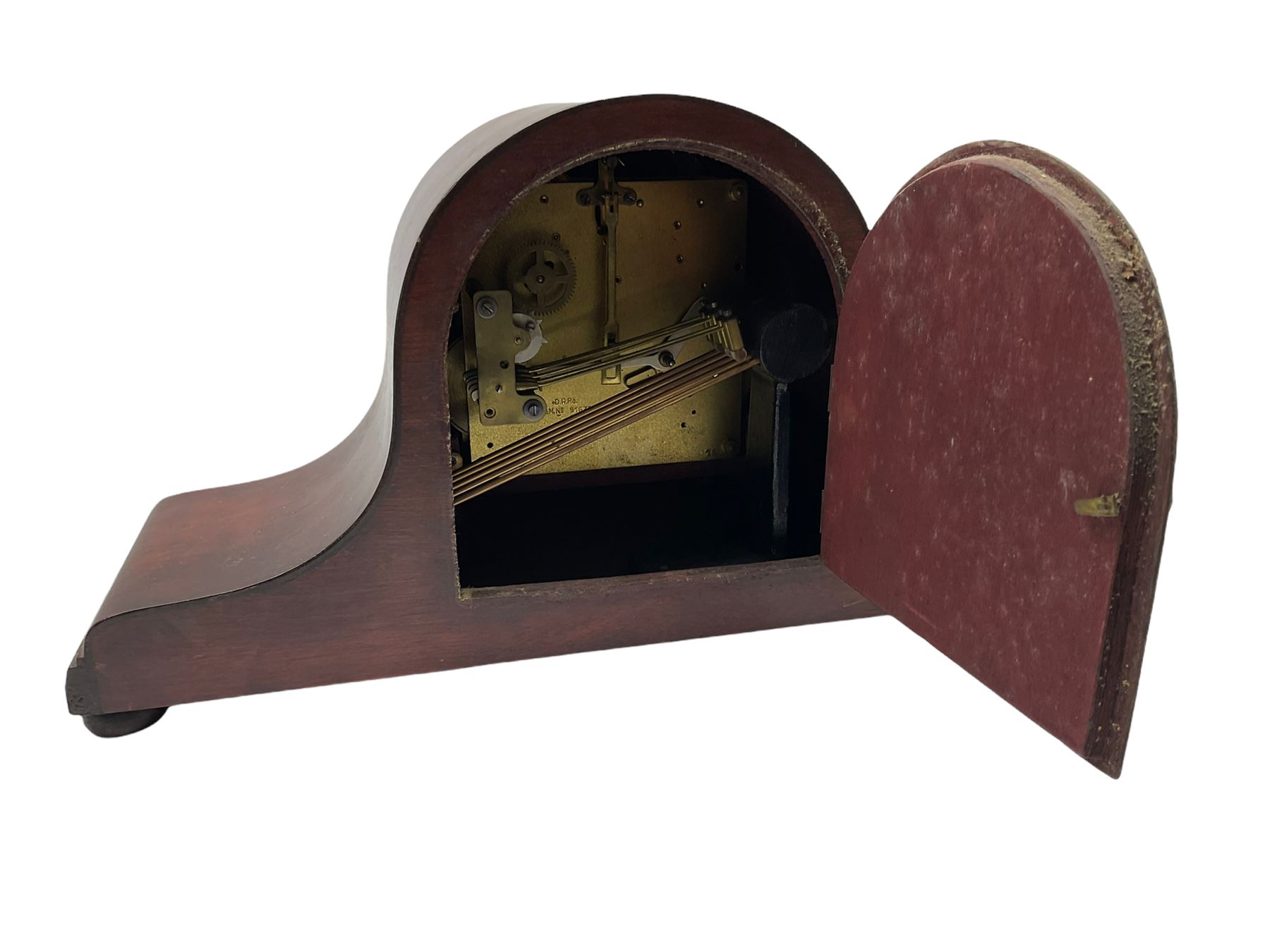 A mahogany cased Tambour clock with a German eight-day movement sounding the quarters and hours on gong rods, with a 6” silvered dial , Arabic numerals and minute track, steel spade hands within a spun brass bezel and convex glass.
With pendulum. 




