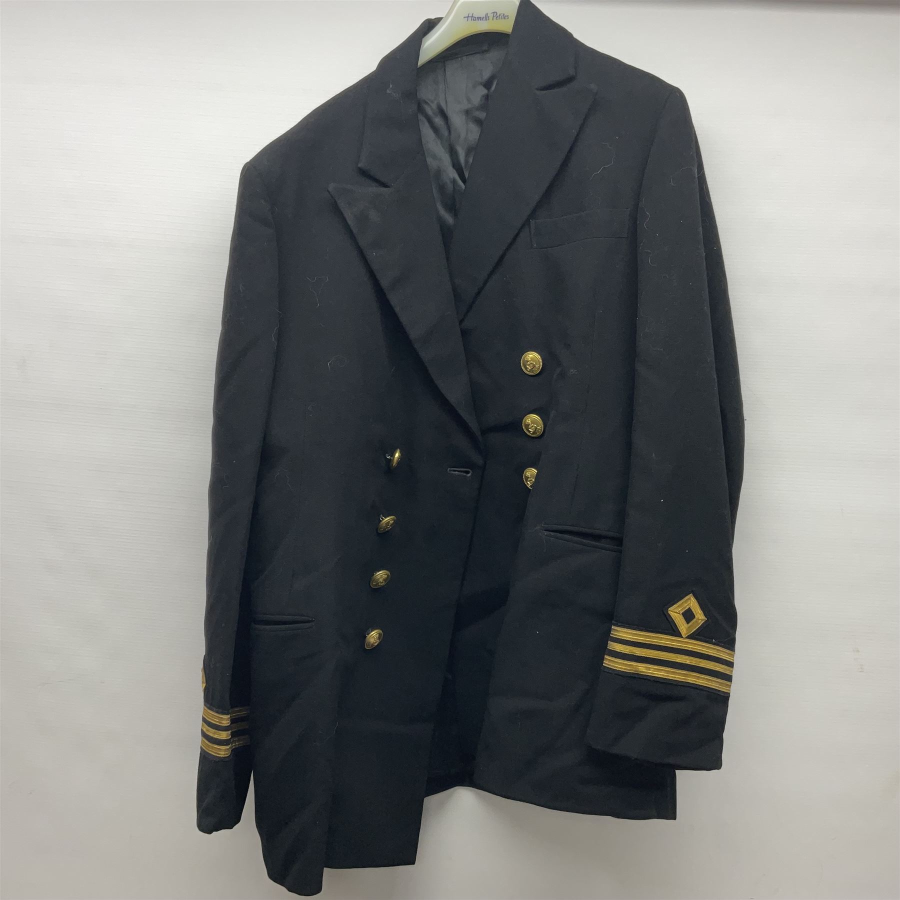 Two post-WWII British Army No.2 Dress tunics, one with Green Howards buttons; army shirt dated 1951; Royal Fleet Auxilliary jacket with trousers; three RAF/WAAF uniforms and RAF Greatcoat; and three canvas/webbing bags, two dated 1943 & 1945