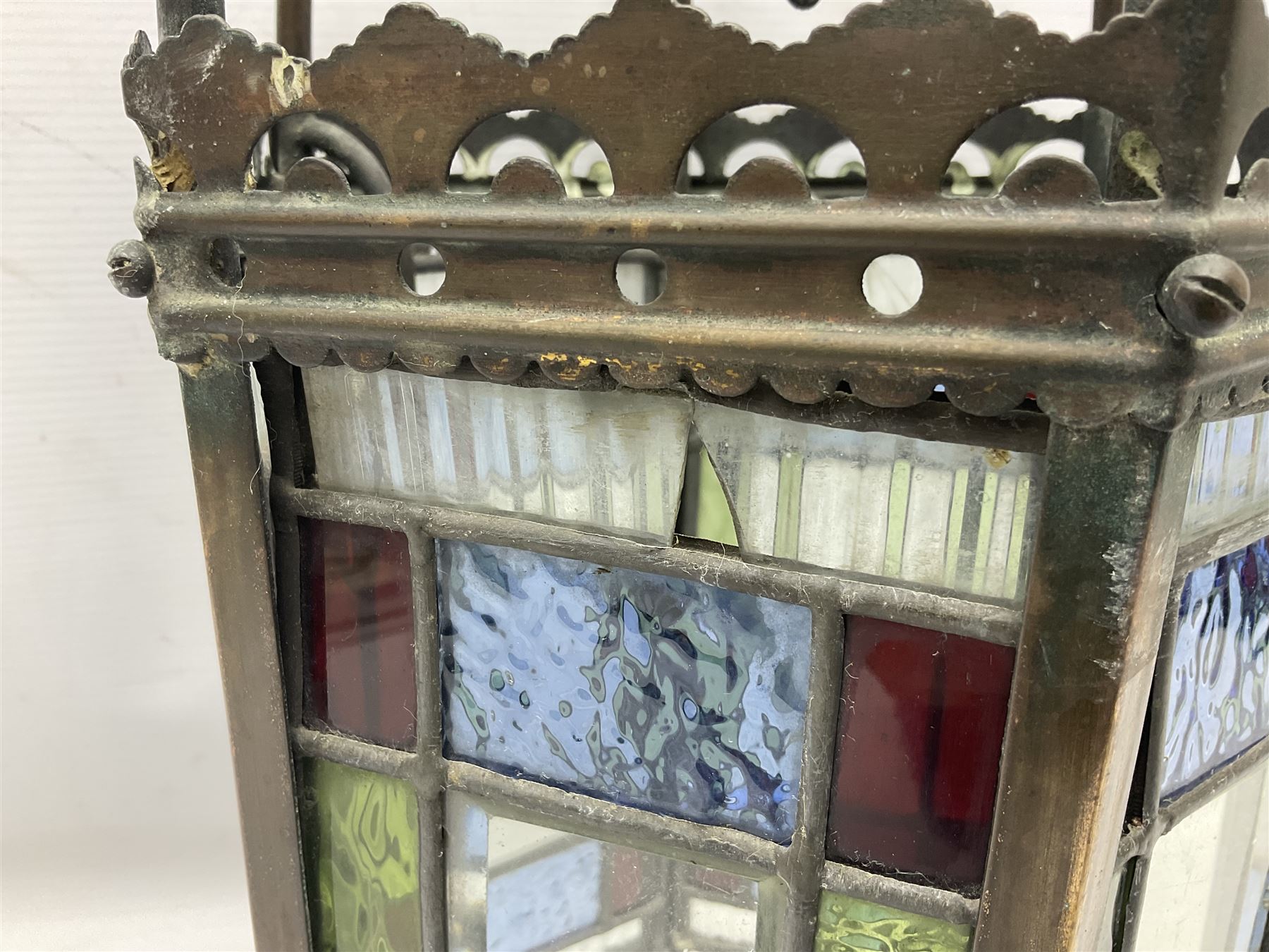 Victorian brass and stained leaded glass hall lantern, of hexagonal form, supported by four domed arms and pierced fret, H46cm W20cm