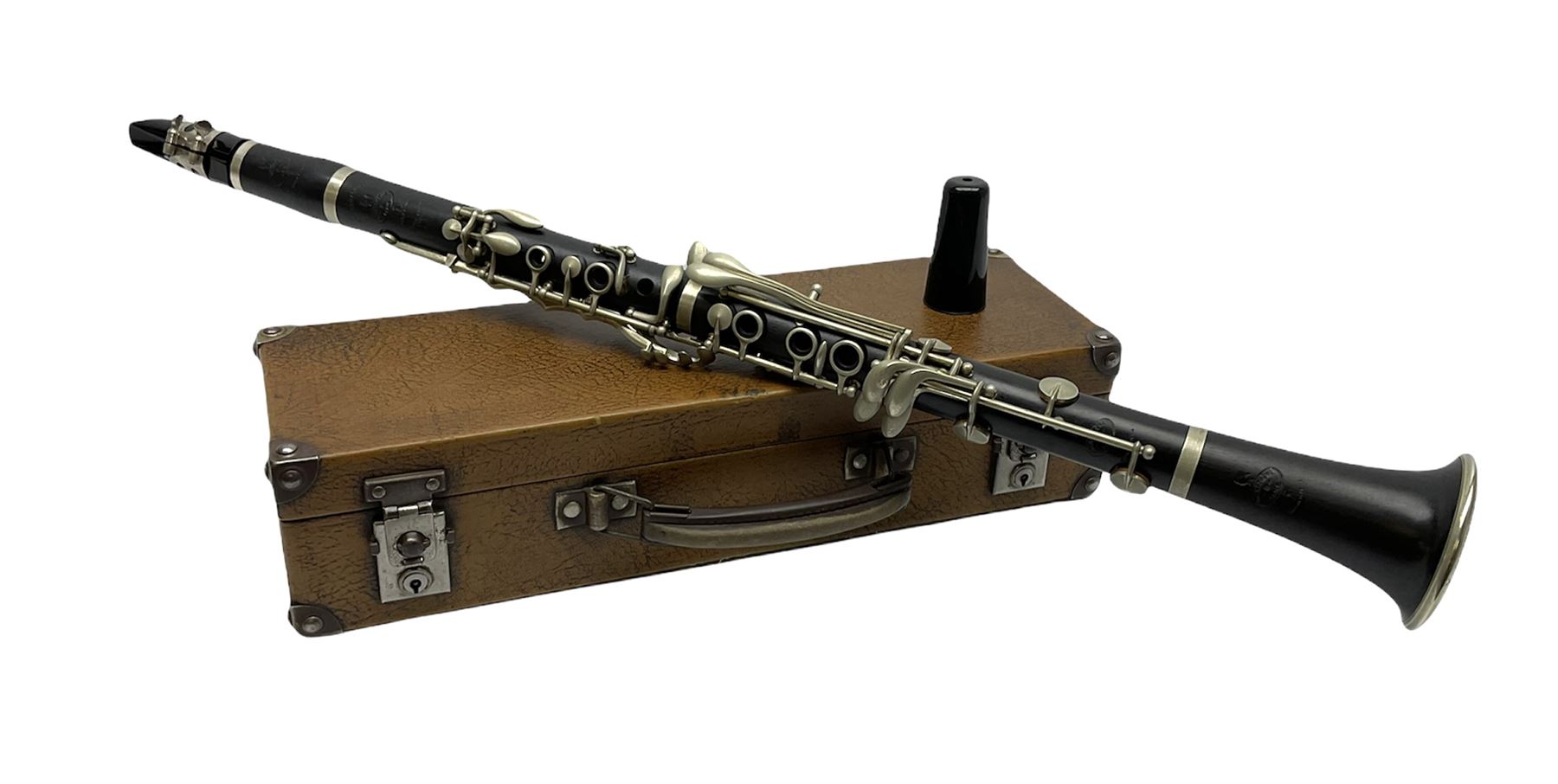 Buffet Crampon Paris African blackwood four-piece clarinet with nickel fittings, impressed 'BCPB 1937', multiple stamps for 'Macdonough & Son Sole Agent London' L67cm; in rexine covered case with two unused reeds. Biographical information: The Macdonagh family have links with the Royal Philharmonic Orchestra and are also reputedly linked with Thomas Macdonagh who was involved in the 1916 Irish uprising.