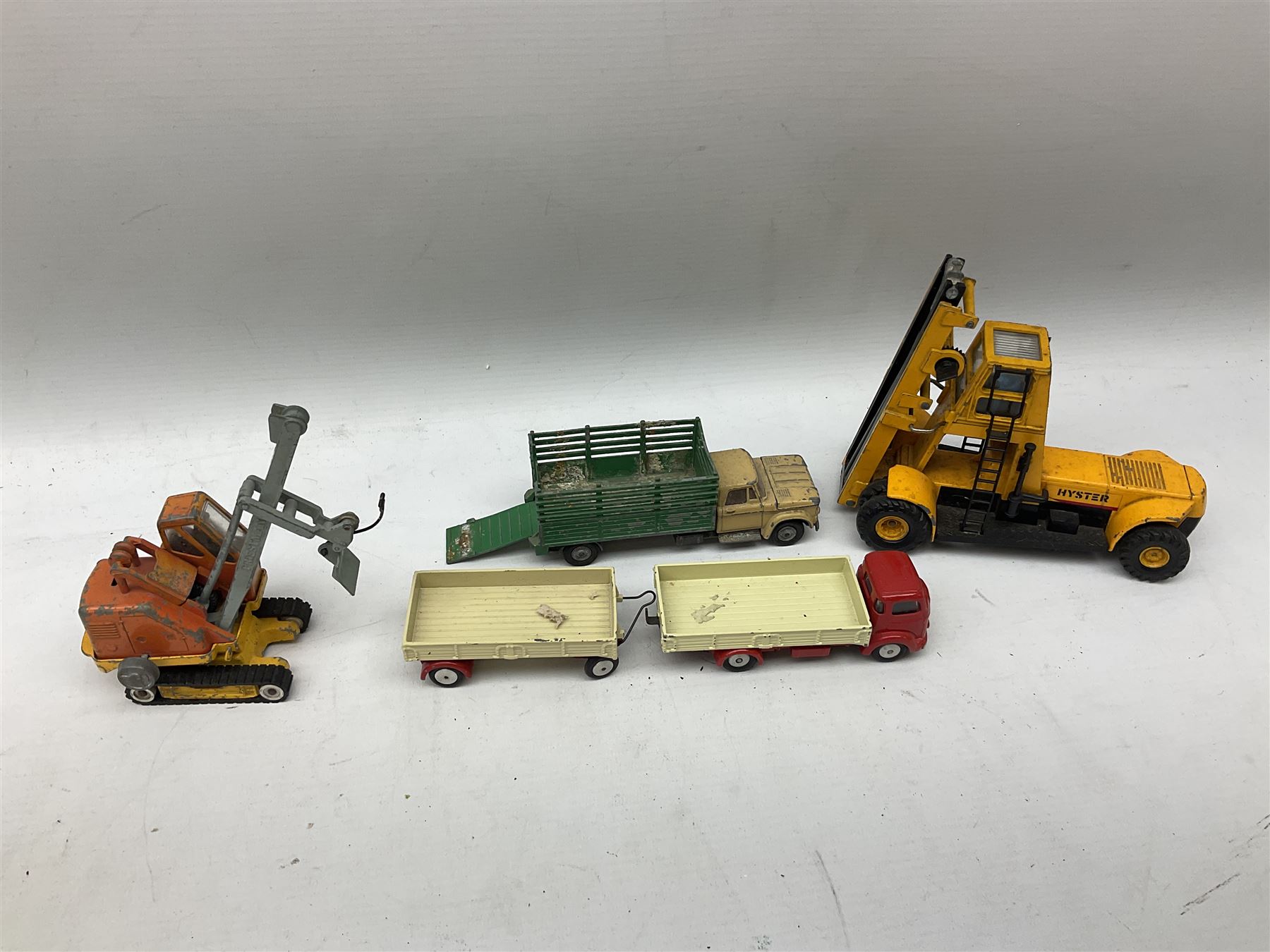 Corgi - eighteen unboxed and playworn/repainted die-cast commercial vehicles including Commer 5-Ton Wagon with drop-side trailer and two other 5-Ton wagons, Dodge Key Fargo, Jeep FC-150, two London Routemaster buses, Carrimore Trideck Transporter, two Carrimore Mark IV Transporters, Carrimore Low Loader, Ecurie Ecosse Racing Car Transporter etc (18)