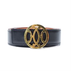 Hermès - reversible black and tan leather belt, with large gilt-metal circular openwork H...