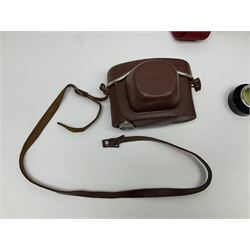 Canon EOS 50e camera body, serial no 8305671 with 'Canon Zoom EF 35-135mm 1:4-5.6' lens together with Halina 35X super camera body, with 'Halina Anastigmat f.c. 1:3.5 f=45mm' lens and other camera equipment 