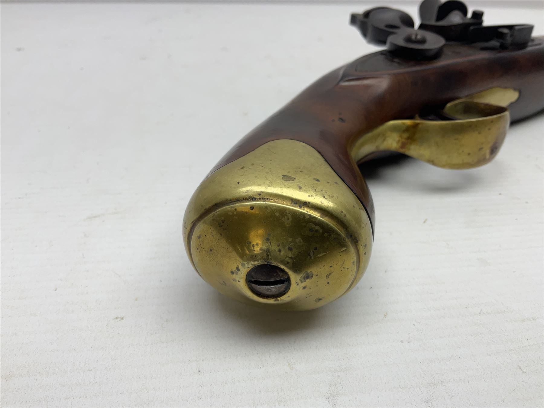 Modern non-firing reproduction Tower flintlock pistol marked with crowned GR and Tower to the lock, brass skull crusher butt and fittings L40cm overall; another Indian/Moorish reproduction flintlock pistol with mother-of-pearl inlay; and a modern die-cast replica Colt style revolver (3)