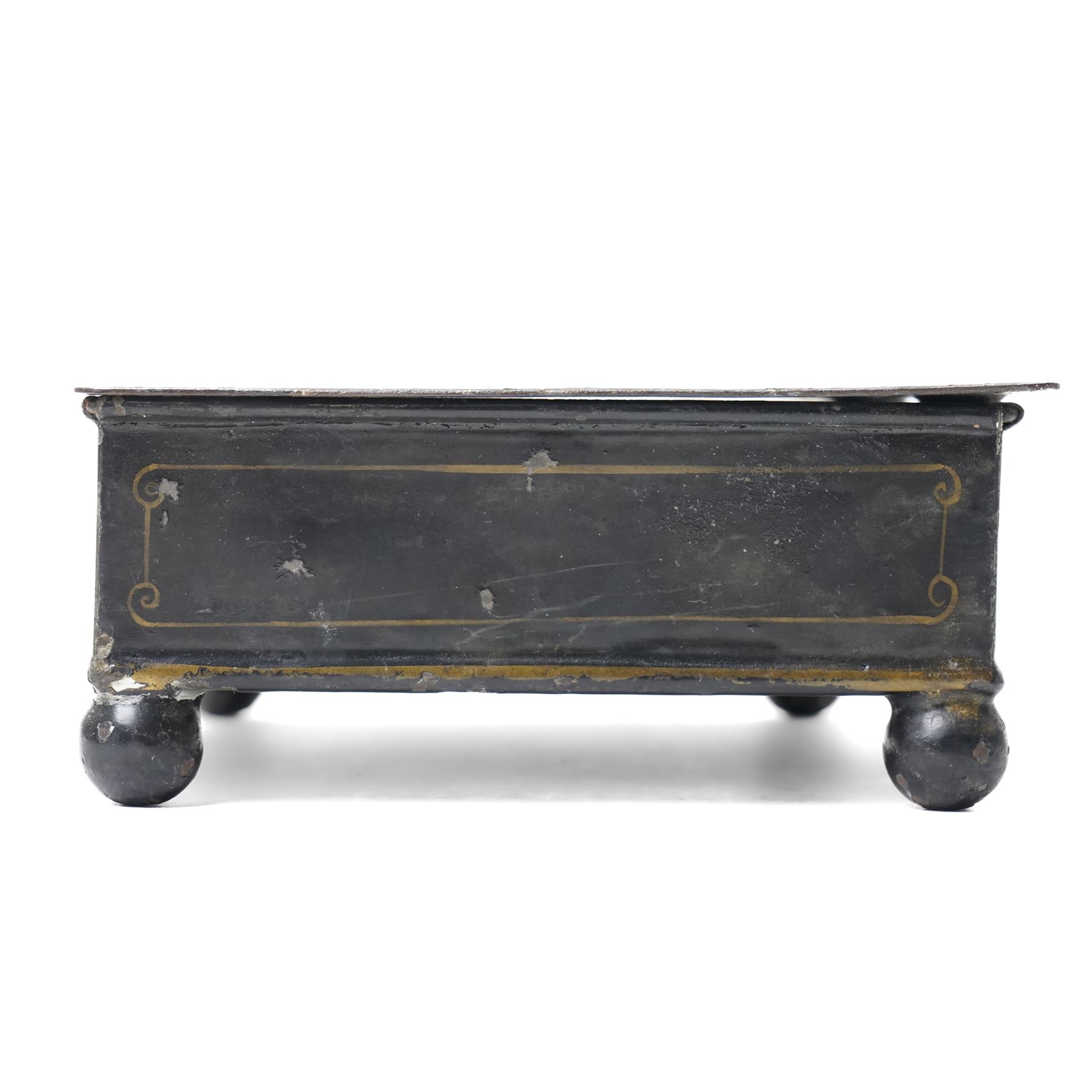 19th century toleware stationary or wafer box, possibly German, with painted cover depicting a child holding oversized quill, seated at a davenport, W20.5cm D13.5cm