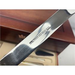 Waltmann und Sohn part canteen of stainless steel and gilt cutlery, the stained wood case with hinged lid above two fitted drawers, L48cm