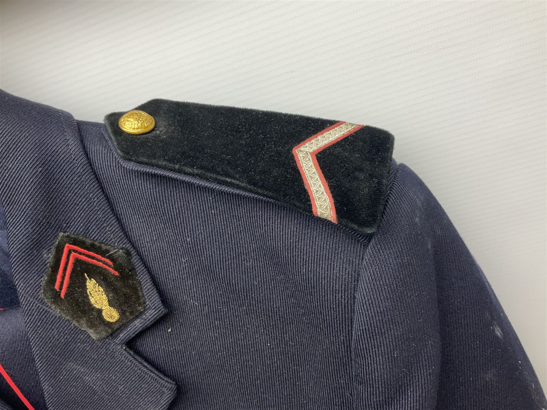 Mid 20th century French Ugeco Nantes first class dress navy blue uniform with ribbon bar with cap, and quantity of Sapeurs Pompiers patches, Sapeurs Pompiers de Caen belt buckle etc