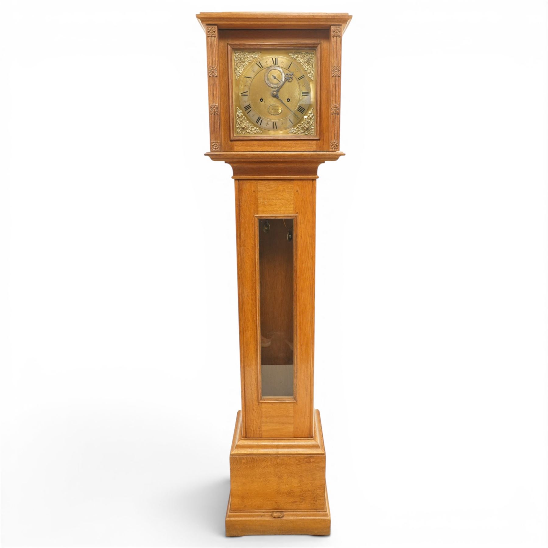 Mouseman - mid-20th century oak longcase clock, with a high quality weight driven movement and dial by Sinclair and Harding & Co of Cheltenham, the rectangular hood carved with foliate ornament, over a glazed and oak trunk on stepped base, with carved mouse signature, by the workshop of Robert Thompson of Kilburn Provenance: purchased directly from the Kilburn workshop in the 1940s/1950s