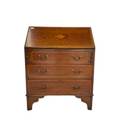 Edwardian mahogany bureau, the fall front inlaid with shell motif, fitted with three drawers, on bracket feet