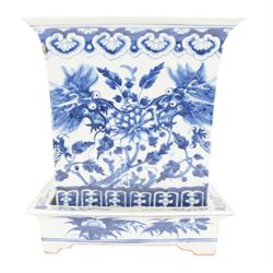 Chinese blue and white planter and stand, each of square slightly tapering and flared form, the planter decorated with two dragons and blossoming peonies, between stylised borders, the stand decorated with flower heads and vines, planter H30cm W29cm, stand H7cm D28.5cm
