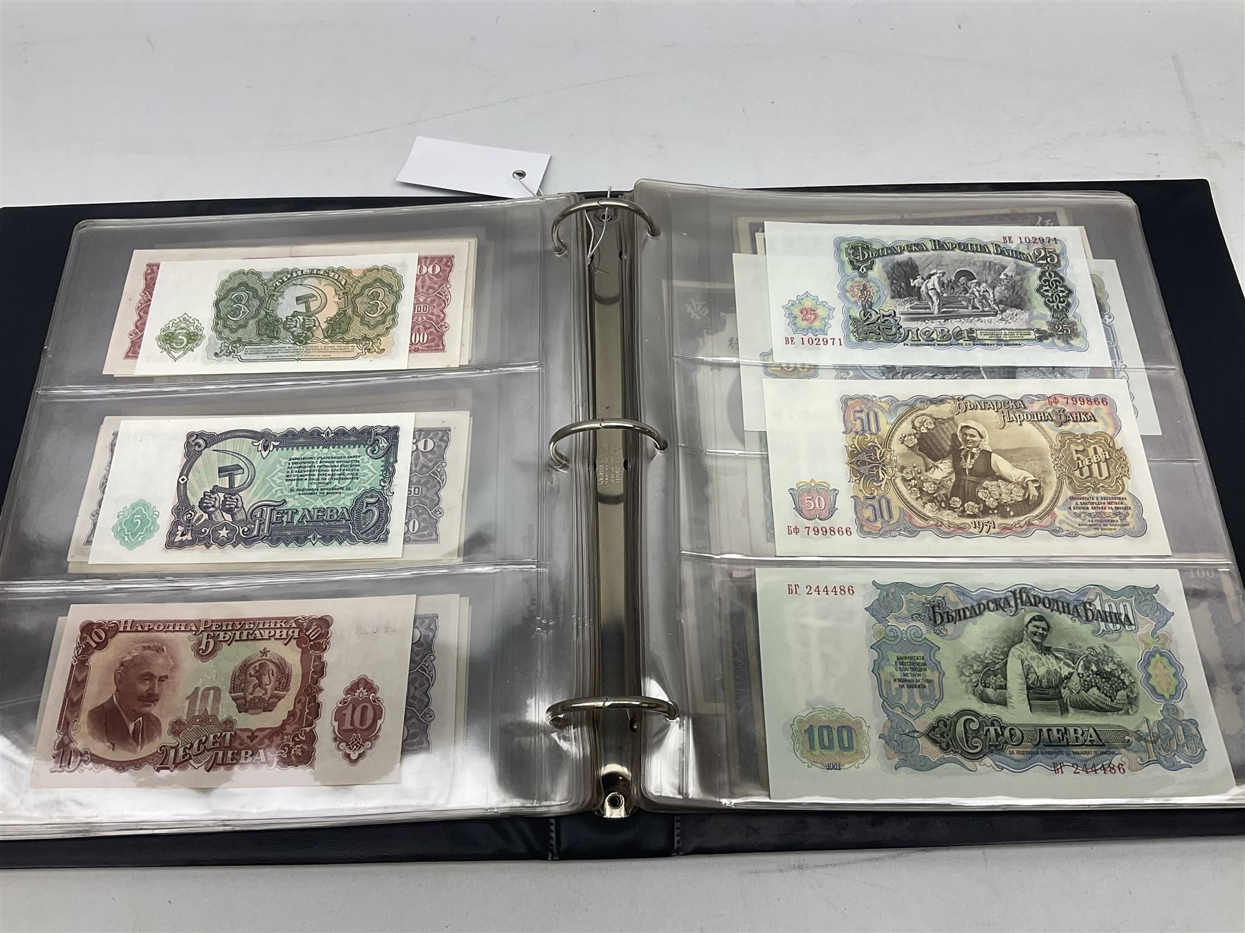 World banknotes, including Queen Elizabeth II The States of Jersey one pound 'DB202703', five pounds 'BB527762' and ten pounds 'AB651481', reserve bank of New Zealand two dollars '1L3 741894', King George V Straits Settlements one dollar 1st January 1935 'F/83 28924', various Bank of England notes etc, housed in two ring binder albums