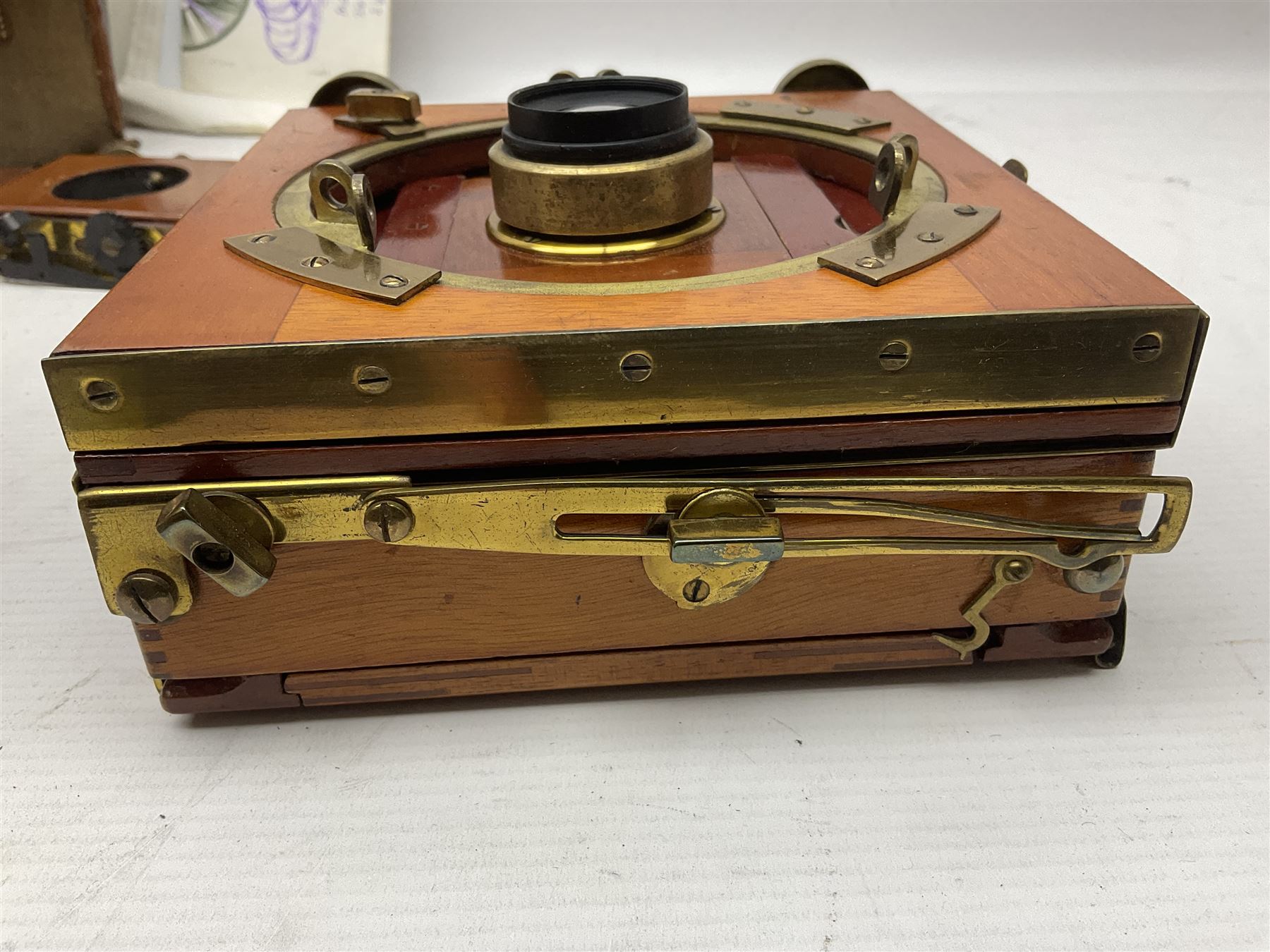 Sands Hunter & Co Ltd folding 1/4 plate camera in mahogany and lacquered brass, with two lenses and leather case