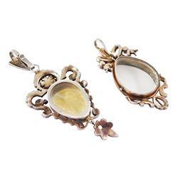 Two 19th century French silver pearl locket pendants, the first set with a pear shaped portrait miniature of a woman in 18th century dress on ivory, within a milled bezel and openwork split and seed pearl surround, the other of similar design with ribbon surmount and set with garnets and seed pearls, both hallmarked. This lot has been registered for sale under Section 10 of the APHA Ivory Act