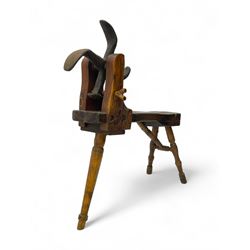 Early 19th century cobbler's work bench, in various woods, revolving cast iron last on yew wood supports, pine seat with inset maker's plaque inscribed 'No 7 Josh Blacker Harehills Leeds', on turned elm front supports and turned beech rear supports 