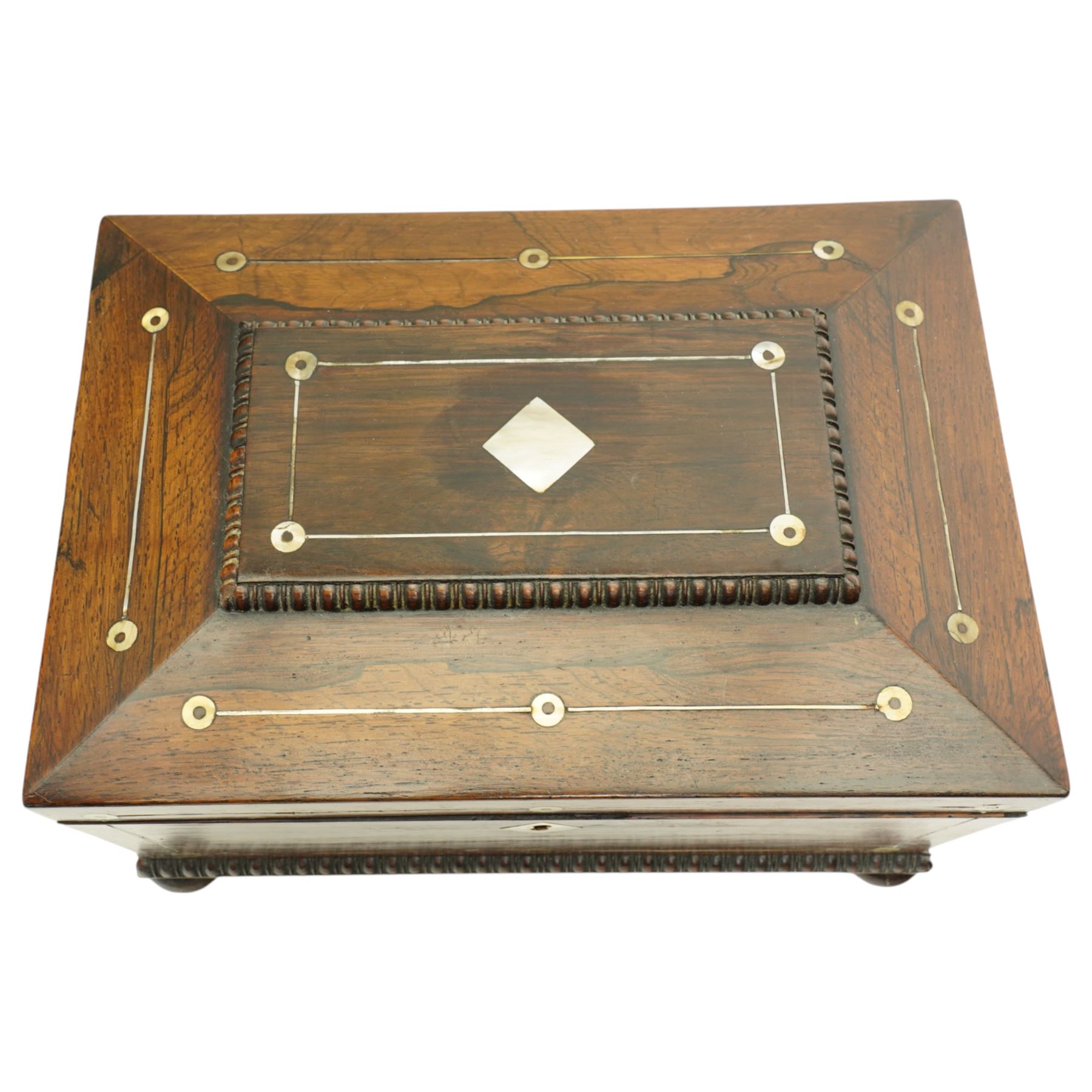 Victorian rosewood sewing box inlaid with mother of pearl, the interior with lift out tray, gadrooned border and compressed bun feet 30cm x 20cm 