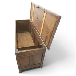 Large 17th century oak coffer, plank top with moulded edge, four panel front with channel moulded uprights, retaining original wrought iron strap hinges and central lock plate, panelled ends, raised on stile supports