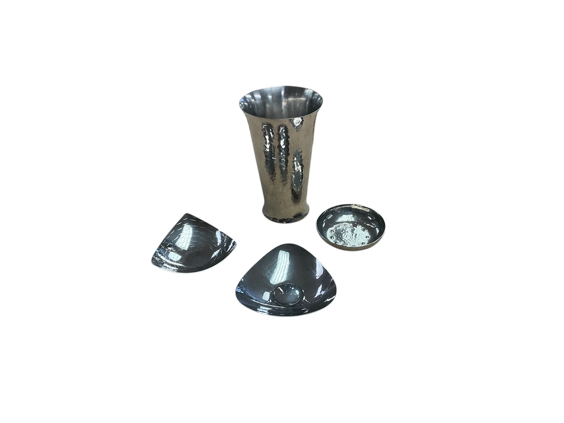 Keswick school of art hammered with fluted rim, together with three Keswick dishes 