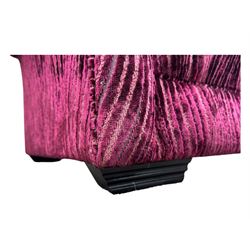 Contemporary Chesterfield design two-seat sofa, upholstered in fuchsia crushed velvet with a ribbed and tufted design, the rolled arms and deep-buttoned backrest raised on square block supports