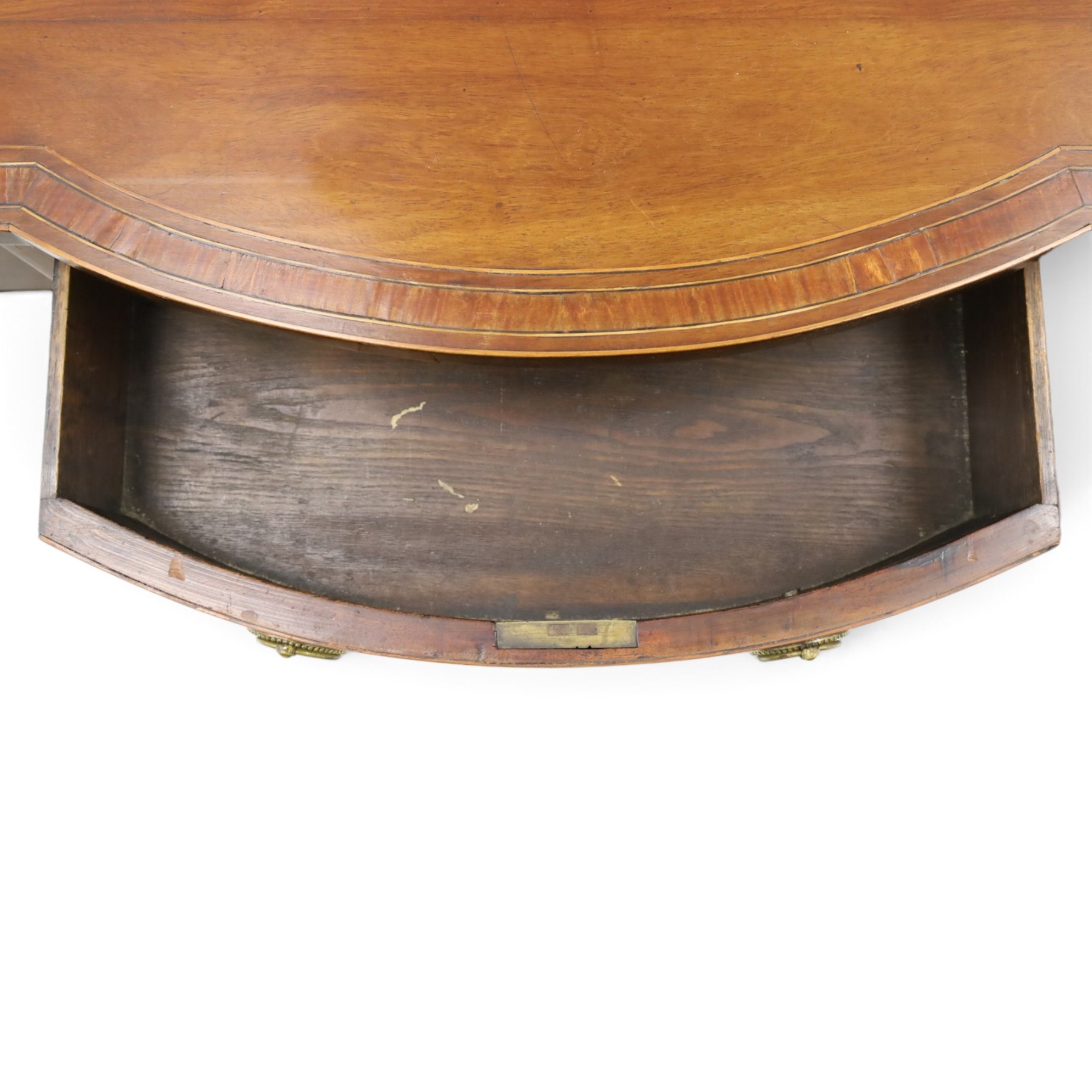 Regency period inlaid mahogany bow-breakfront sideboard, shaped rectangular top with crossbanding and ebony stringing, central convex frieze drawer flanked by cupboard and cellarette drawer, over fan-inlaid spandrels, raised on square tapering supports