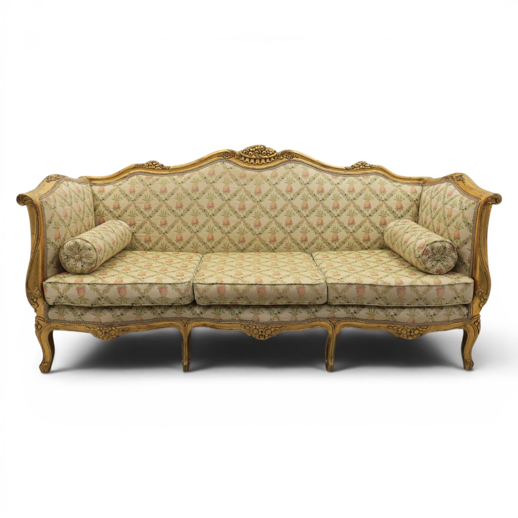 Louis XV design giltwood framed settee, the frame with applied foliate detail,  three loose seat cushions, upholstered in pineapple patterned fabric