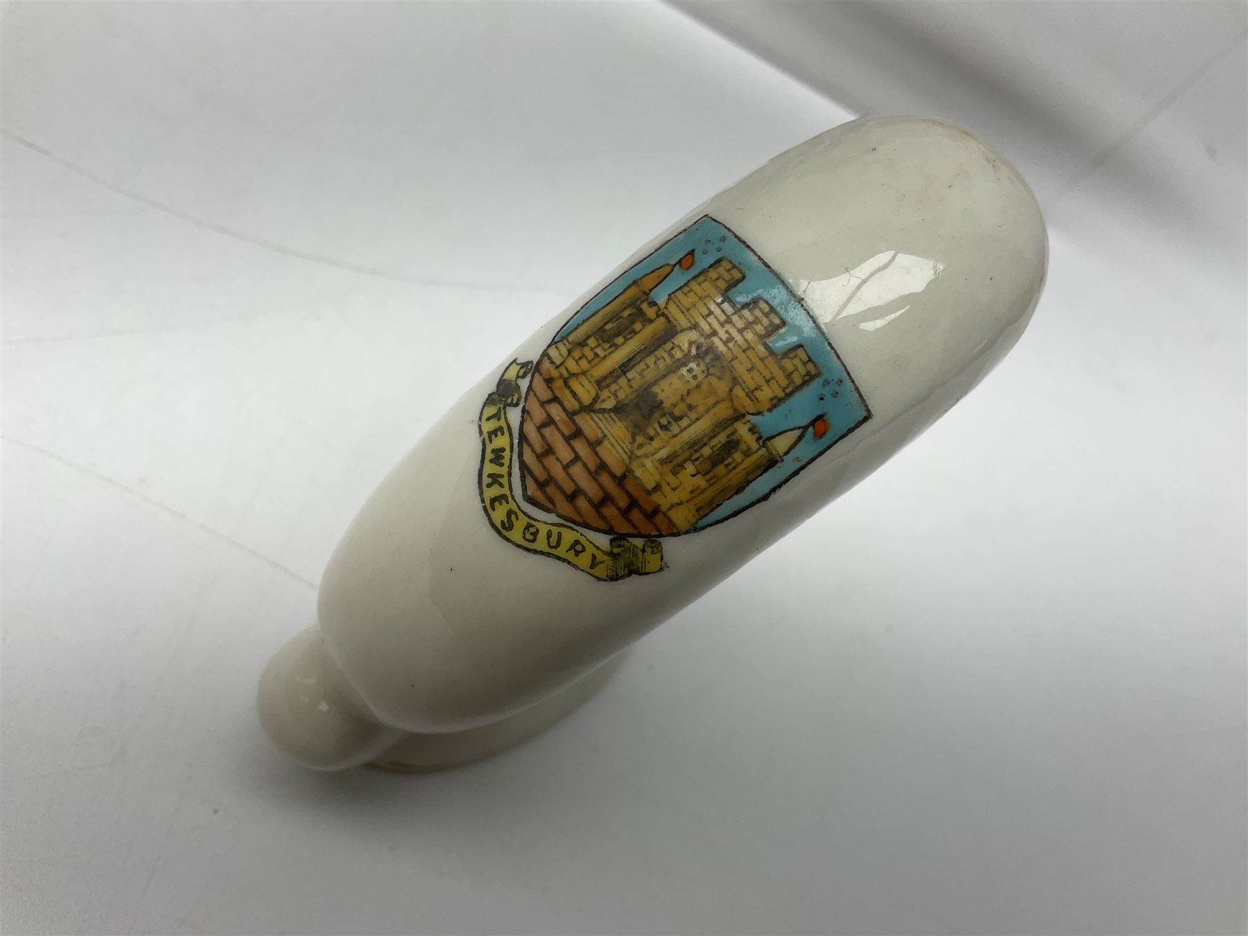 Ten WW1 crested china military models comprising submarine, four ships including Lusitania, four Zeppelins/balloons and an aircraft; various makers including Arcadian China, Swan China, Carlton China, Waterfall, Grafton China etc; various crests including Saint Neots, Great Yarmouth, Tewksbury, Swanage, Simons Town, Hull etc (10)